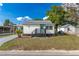 Charming home with a covered carport, well-maintained lawn, and landscaped front yard, perfect for curb appeal at 906 Se 3Rd St, Mulberry, FL 33860