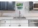 Close-up of a kitchen sink with granite countertops and modern faucet at 906 Se 3Rd St, Mulberry, FL 33860