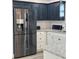 Modern kitchen featuring stainless steel appliances, granite countertops, and elegant cabinetry at 906 Se 3Rd St, Mulberry, FL 33860