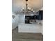 Open concept kitchen area featuring an island with granite countertops and stylish cabinetry at 906 Se 3Rd St, Mulberry, FL 33860