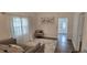 Open-concept living room features natural light and neutral paint tones at 906 Se 3Rd St, Mulberry, FL 33860