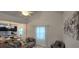 Cozy living room featuring natural light, a vaulted ceiling and a view to the kitchen at 906 Se 3Rd St, Mulberry, FL 33860