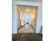 Hallway between rooms with tile floors, and white trim at 103 Bougainvillea Dr, Leesburg, FL 34748