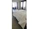 Bright bedroom features natural light and balcony access, enhancing the open space at 1 Oceans West Blvd # 3B4, Daytona Beach, FL 32118
