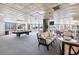 Large common area featuring a pool table, seating, and large windows at 1 Oceans West Blvd # 3B4, Daytona Beach, FL 32118
