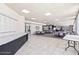 Spacious common area with tables, chairs, and updated flooring at 1 Oceans West Blvd # 3B4, Daytona Beach, FL 32118