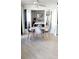 Charming dining area near the bedroom with round white table, and stylish upholstered chairs at 1 Oceans West Blvd # 3B4, Daytona Beach, FL 32118