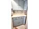 Charming kitchen featuring light blue cabinets, granite countertops and updated backsplash at 1 Oceans West Blvd # 3B4, Daytona Beach, FL 32118