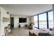 Bright living room with large windows, comfortable seating, and contemporary decor with light floors at 1 Oceans West Blvd # 3B4, Daytona Beach, FL 32118