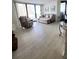 Comfortable living room featuring ample seating, large windows, and light wood flooring at 1 Oceans West Blvd # 3B4, Daytona Beach, FL 32118