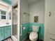 Renovated bathroom features a separate shower and well-placed toilet at 114 Caladium St, Leesburg, FL 34748