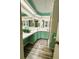 Updated bathroom with stylish fixtures and well-lit mirrors at 114 Caladium St, Leesburg, FL 34748