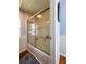 Bathroom with a sliding glass door shower/tub combo at 114 Caladium St, Leesburg, FL 34748