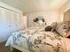 Bedroom with a bed, closet, and dresser at 114 Caladium St, Leesburg, FL 34748
