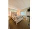 Bright and airy bedroom with closet and TV at 114 Caladium St, Leesburg, FL 34748