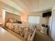 Bedroom with a bed, closet, and TV at 114 Caladium St, Leesburg, FL 34748
