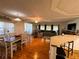 Open layout with a dinning area and living room with natural light at 114 Caladium St, Leesburg, FL 34748