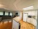 Cozy living space with an eat in kitchen bar and great room with natural light at 114 Caladium St, Leesburg, FL 34748