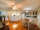 Inviting living space featuring an open kitchen, dining area, and a comfortable living room at 114 Caladium St, Leesburg, FL 34748
