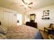 Bedroom showcasing wood floors, a ceiling fan, closet, and a vanity at 123 Pyracantha Ln, Leesburg, FL 34748
