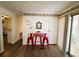 Cozy dining area with seating for two, and sliding glass doors at 123 Pyracantha Ln, Leesburg, FL 34748