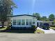 Charming single-story home with well-manicured lawn and ample parking space at 123 Pyracantha Ln, Leesburg, FL 34748