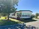 Attractive single-story home with lush lawn, mature trees, and a peaceful residential setting at 123 Pyracantha Ln, Leesburg, FL 34748