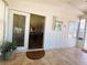 Inviting sunroom with tiled floors and sliding glass doors leading to living area at 123 Pyracantha Ln, Leesburg, FL 34748
