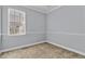 Bedroom featuring neutral color palette and large window at 1333 Darnaby Way, Orlando, FL 32824