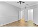 Bedroom featuring hardwood floors, neutral color palette, and closet space at 1333 Darnaby Way, Orlando, FL 32824
