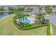 Beautiful community pool surrounded by lush landscaping and comfortable lounge chairs at 1333 Darnaby Way, Orlando, FL 32824