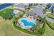 Aerial view of community pool featuring ample lounge chairs and well maintained landscaping at 1333 Darnaby Way, Orlando, FL 32824