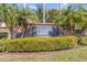 Harbor Lakes community sign surrounded by lush greenery and palm trees at 1333 Darnaby Way, Orlando, FL 32824