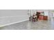 Open dining area featuring tile floors and an adjacent kitchen and breakfast bar at 1333 Darnaby Way, Orlando, FL 32824