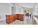 Kitchen island featuring dark countertops, cabinets, and stainless steel sink at 1333 Darnaby Way, Orlando, FL 32824