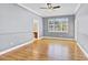 Large main bedroom with hardwood floors and an ensuite bathroom, offering comfort and style at 1333 Darnaby Way, Orlando, FL 32824