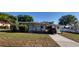 Cozy single-story home featuring a well-maintained front yard and convenient carport at 1540 Avenue C Ne, Winter Haven, FL 33881