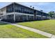 The building's exterior has private screened patios and landscaped lawn at 1640 Juno Trl # 101A, Astor, FL 32102