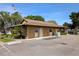 The exterior of the community clubhouse, complete with parking and well maintained landscaping at 1640 Juno Trl # 101A, Astor, FL 32102