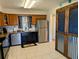 The cozy kitchen featuring granite countertops, stainless steel appliances and tile flooring at 1640 Juno Trl # 101A, Astor, FL 32102