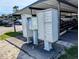 Cluster mailboxes located under carport; boat and truck parked in background at 1640 Juno Trl # 101A, Astor, FL 32102