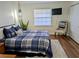 Comfortable bedroom featuring a bed, bedside table and TV at 1640 Juno Trl # 101A, Astor, FL 32102