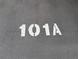 Parking spot number 101A painted on asphalt at 1640 Juno Trl # 101A, Astor, FL 32102