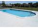 The fenced in community pool is sparkling and ready for a swim at 1640 Juno Trl # 101A, Astor, FL 32102