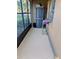 Screened-in patio providing extra storage with a dark gray cabinet and views of outside at 1640 Juno Trl # 101A, Astor, FL 32102