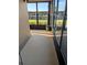 Enclosed sunroom with black frame windows and doors providing views of the outside scenery at 1640 Juno Trl # 101A, Astor, FL 32102