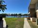 Serene view of the water from the backyard, enhanced by lush green grass at 1640 Juno Trl # 205B, Astor, FL 32102