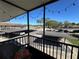 Condo balcony overlooking covered parking spaces, offering convenience and outdoor enjoyment at 1640 Juno Trl # 205B, Astor, FL 32102