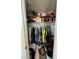 Full closet with clothes and other items and some shelving space at 1640 Juno Trl # 205B, Astor, FL 32102