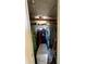 Full closet containing shelves, hanging clothes, and personal items at 1640 Juno Trl # 205B, Astor, FL 32102